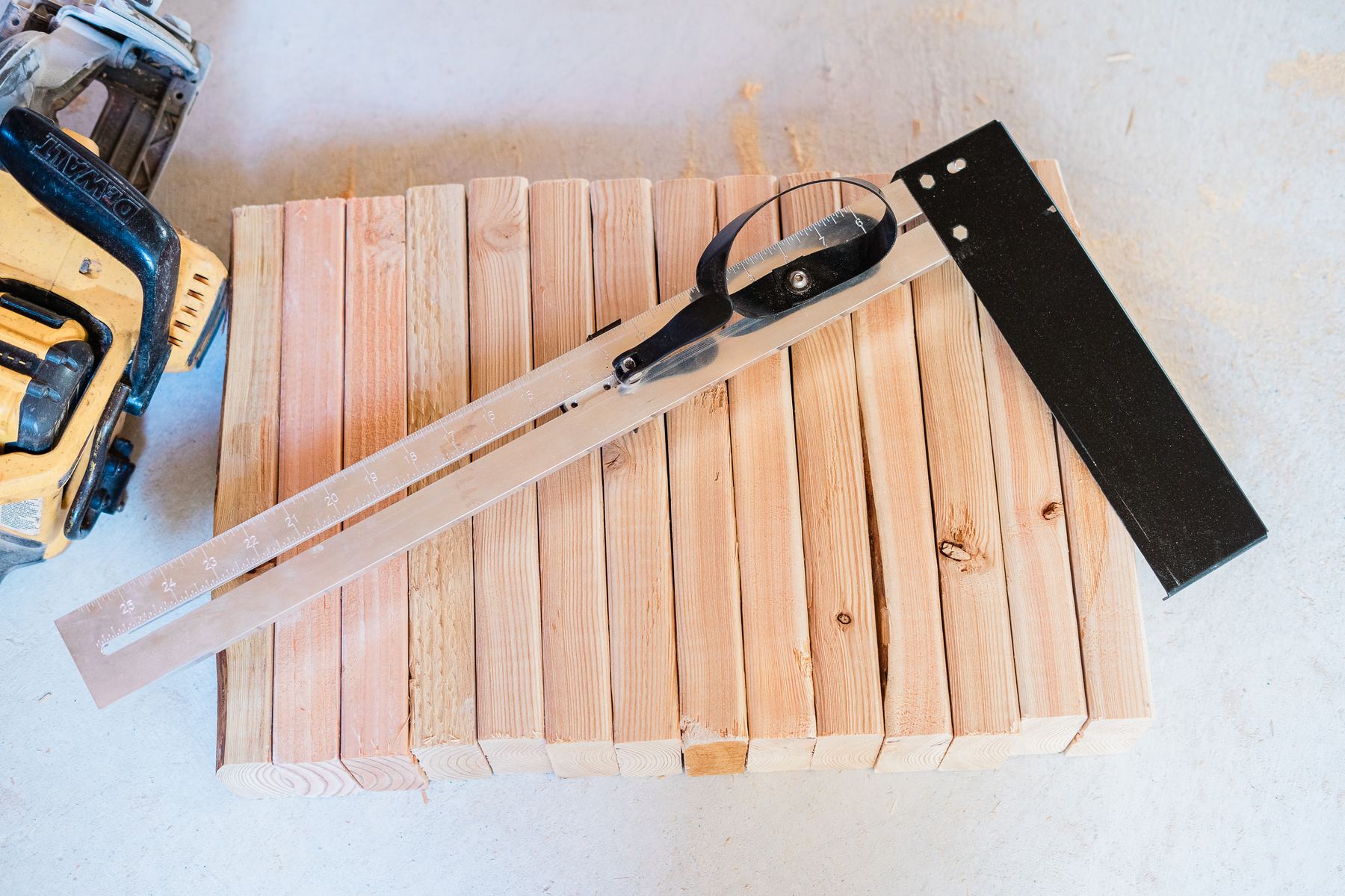 The CutBoss Original on a stack of cut 2x4 blocking next to a circular saw